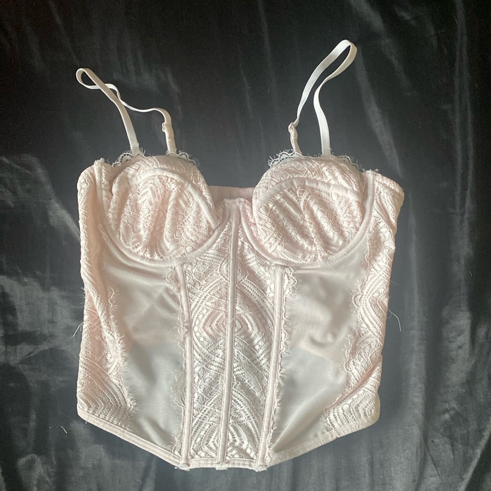 light pink garage corset top with stretchy adjustable straps